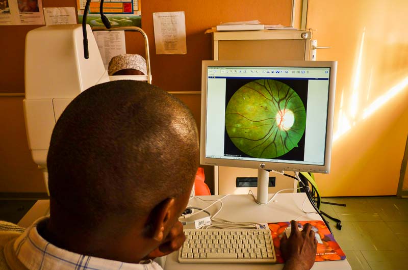 Nurse Baele Fidzani grades an image at Donga Diabetes Centre, Francistown. BOTSWANA. Peter Blows