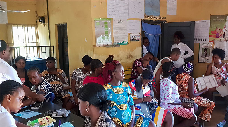 Several pregnant women sitting in an antenatal clinic waiting area