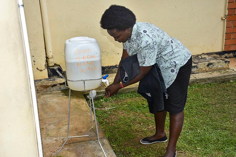 A lady washed her hands at a clean water/tap station