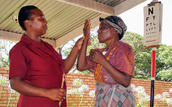 An older women has her vision tested. SWAZILAND. © Daisy Wilson